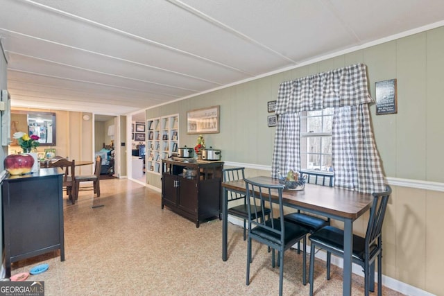 dining room with a decorative wall