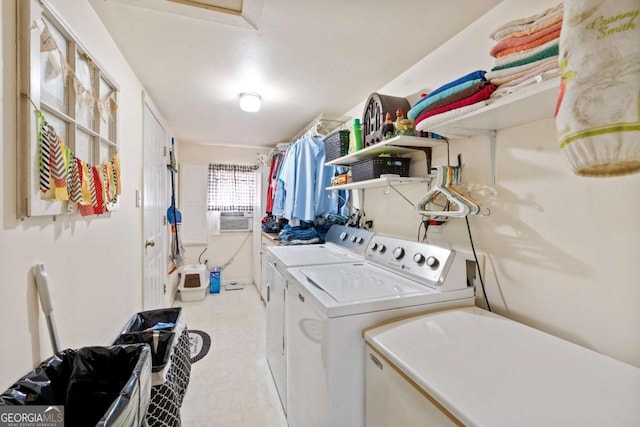 laundry room featuring laundry area, cooling unit, and washing machine and dryer