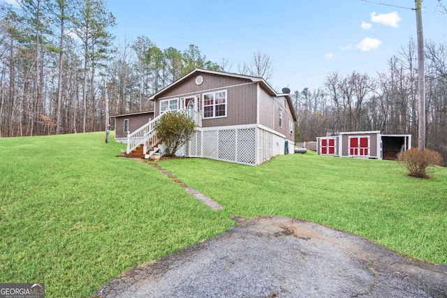 view of side of home featuring a yard