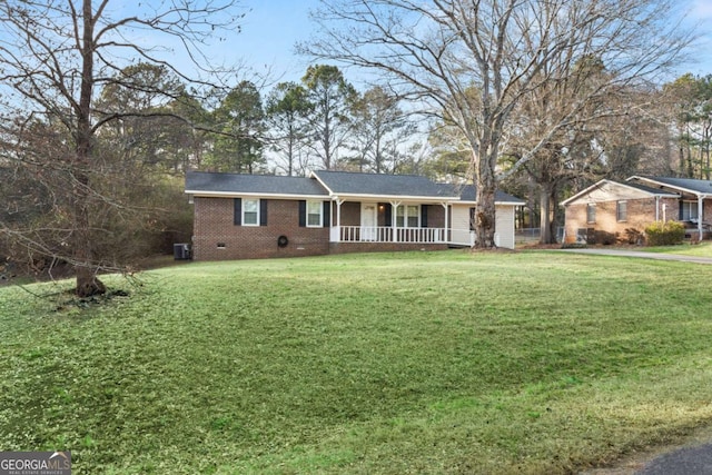 ranch-style home with crawl space, covered porch, brick siding, and a front lawn