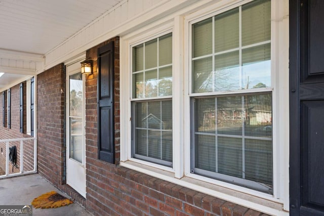 entrance to property with brick siding