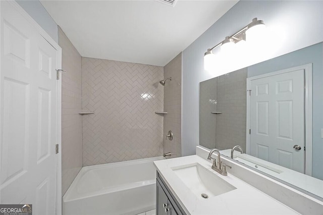 bathroom featuring  shower combination and vanity