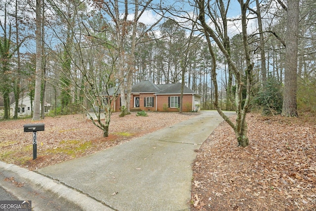 ranch-style home featuring brick siding