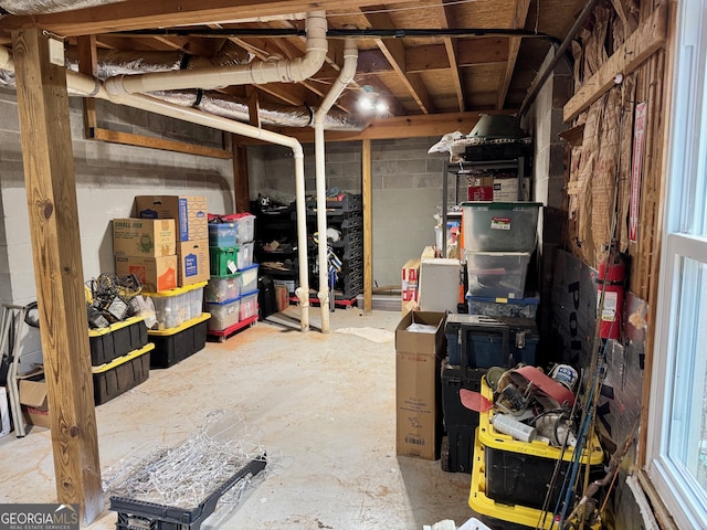 unfinished basement with concrete block wall