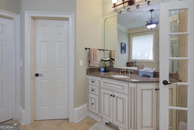 8440 Woodland Brooke Trl, Cumming, GA 30028 - bathroom featuring vanity, crown molding, tile patterned flooring, and baseboards