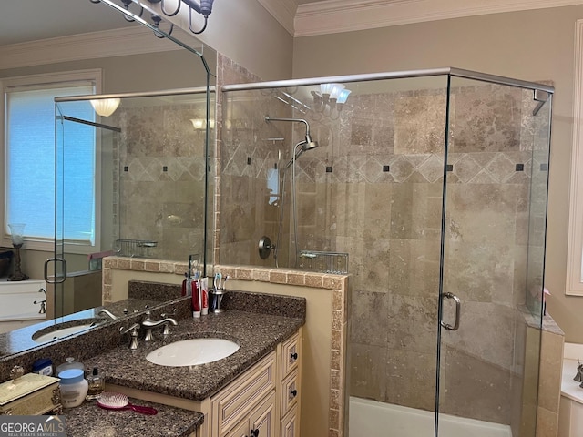 bathroom with ornamental molding, a stall shower, and vanity