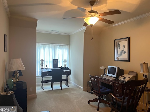 home office featuring crown molding, light colored carpet, visible vents, ceiling fan, and baseboards