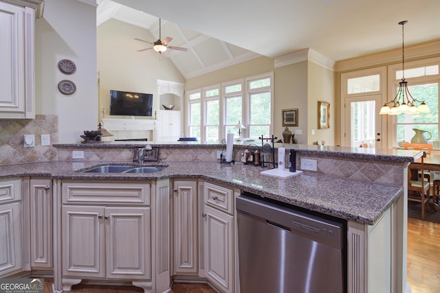8440 Woodland Brooke Trl, Cumming, GA 30028 - kitchen with stainless steel dishwasher, a sink, ceiling fan, open floor plan, and stone countertops
