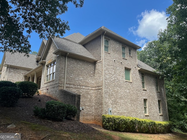 view of home's exterior featuring brick siding