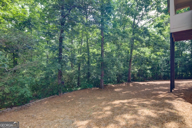 8440 Woodland Brooke Trl, Cumming, GA 30028 - view of yard with a forest view