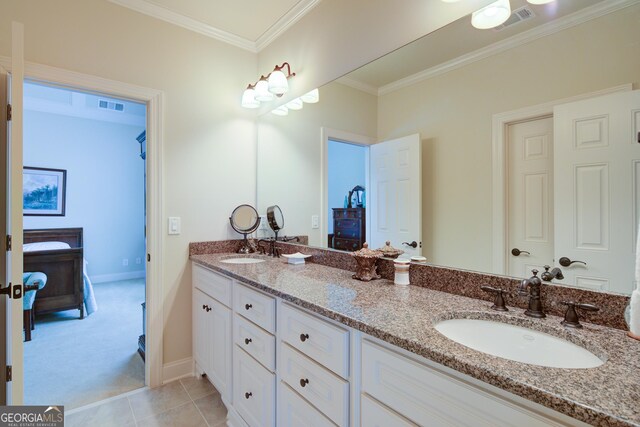 8440 Woodland Brooke Trl, Cumming, GA 30028 - bathroom with double vanity, a wood stove, baseboards, ornamental molding, and tile patterned floors
