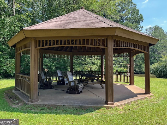 8440 Woodland Brooke Trl, Cumming, GA 30028 - surrounding community with a gazebo, a yard, a patio area, and view of wooded area