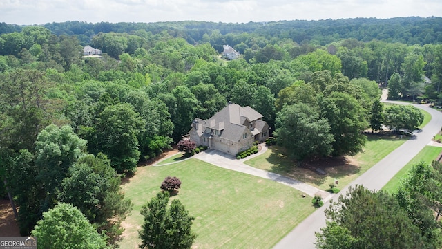8440 Woodland Brooke Trl, Cumming, GA 30028 - view of subject property featuring a heavily wooded area