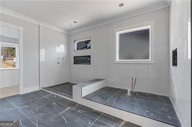 bathroom featuring marble finish floor and crown molding