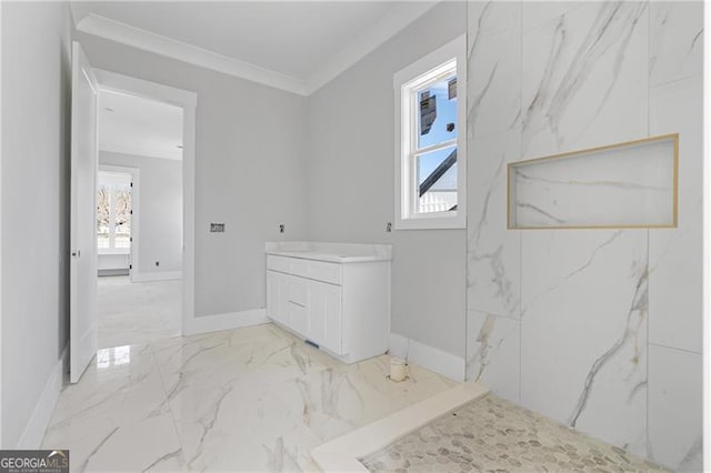 full bath featuring plenty of natural light, marble finish floor, crown molding, and vanity