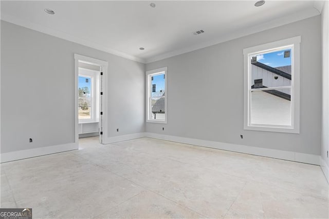 unfurnished room with visible vents, crown molding, and baseboards