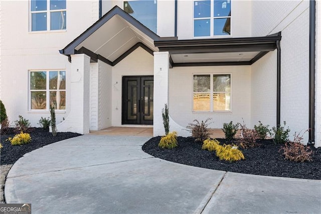 entrance to property with brick siding