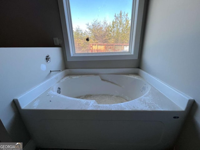 full bath with a garden tub