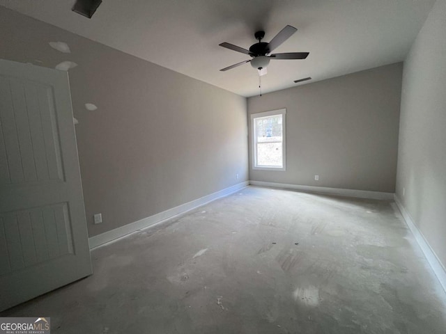 empty room featuring visible vents, baseboards, and unfinished concrete flooring