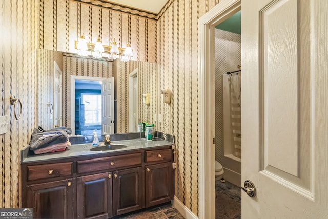 full bath with a shower with curtain, vanity, and wallpapered walls