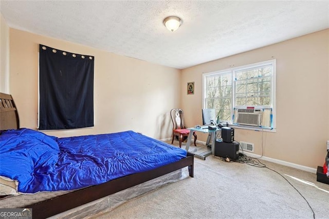 bedroom with visible vents, baseboards, carpet, cooling unit, and a textured ceiling