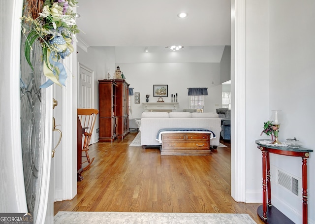 bedroom featuring light wood-type flooring, visible vents, and recessed lighting