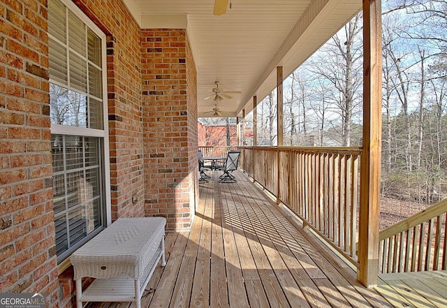 deck featuring ceiling fan and outdoor dining space