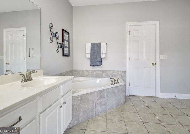 full bath with a garden tub, vanity, and tile patterned floors