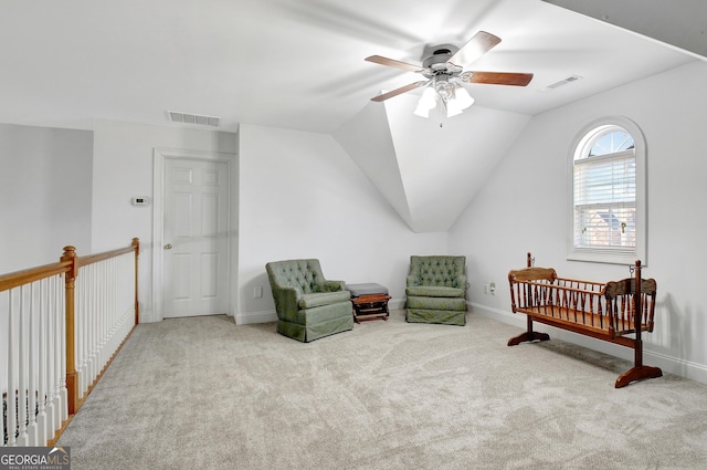 bedroom with light colored carpet, visible vents, and lofted ceiling