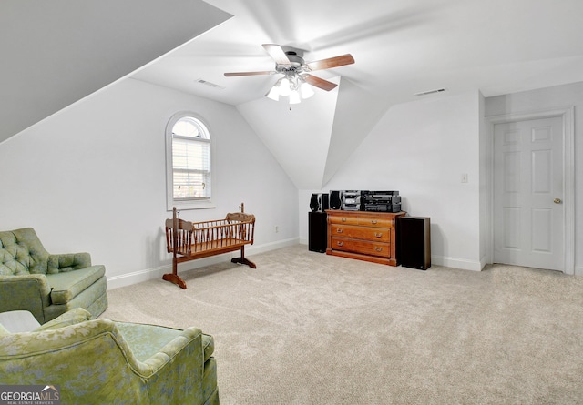 bedroom featuring light carpet, visible vents, and lofted ceiling