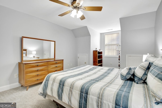 bedroom with lofted ceiling, carpet flooring, a ceiling fan, visible vents, and baseboards