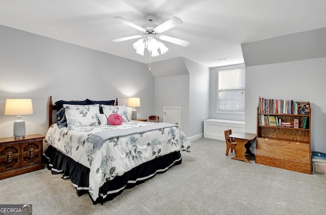 bedroom with visible vents, baseboards, light colored carpet, ceiling fan, and vaulted ceiling