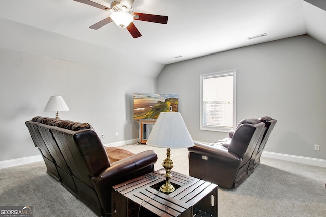 living area featuring lofted ceiling, ceiling fan, light carpet, visible vents, and baseboards