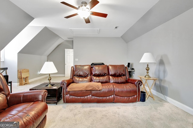 carpeted living room with visible vents, vaulted ceiling, baseboards, and ceiling fan