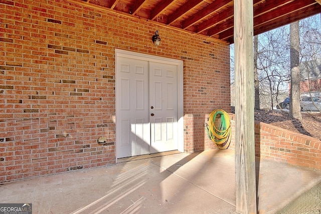 doorway to property with a patio