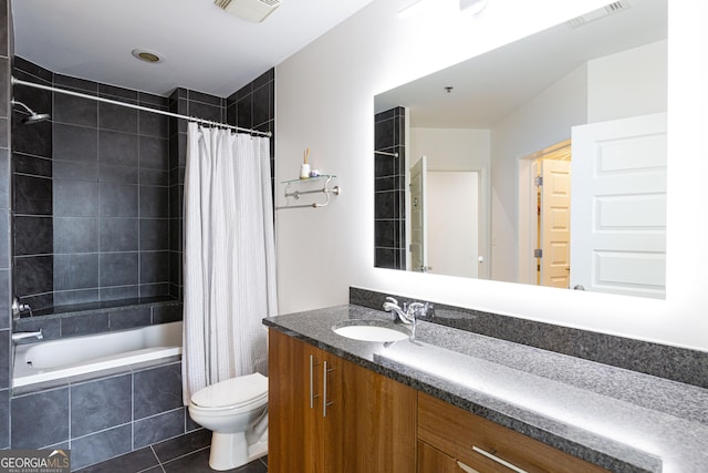 full bathroom with tile patterned flooring, visible vents, vanity, and toilet