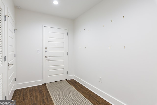 entryway with recessed lighting, dark wood finished floors, and baseboards