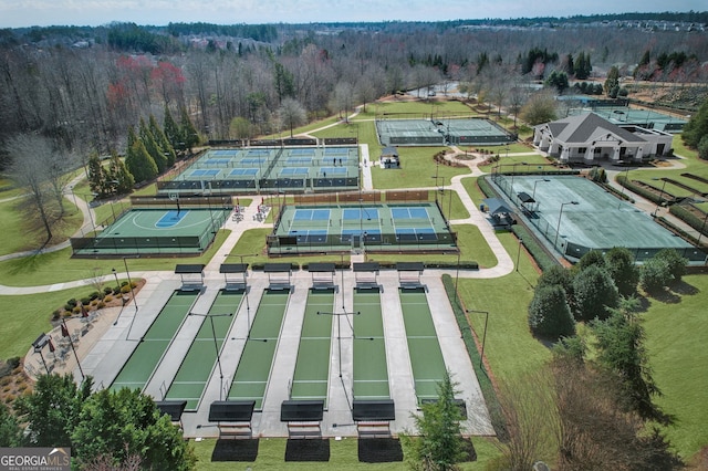 drone / aerial view with a wooded view