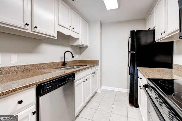 kitchen featuring stainless steel dishwasher, a sink, and white cabinetry