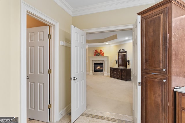 hallway with light carpet, baseboards, ornamental molding, and recessed lighting