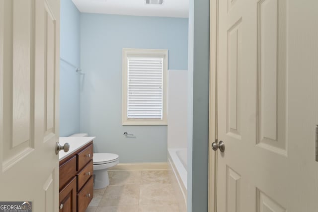 bathroom with visible vents, toilet, vanity, baseboards, and tile patterned floors