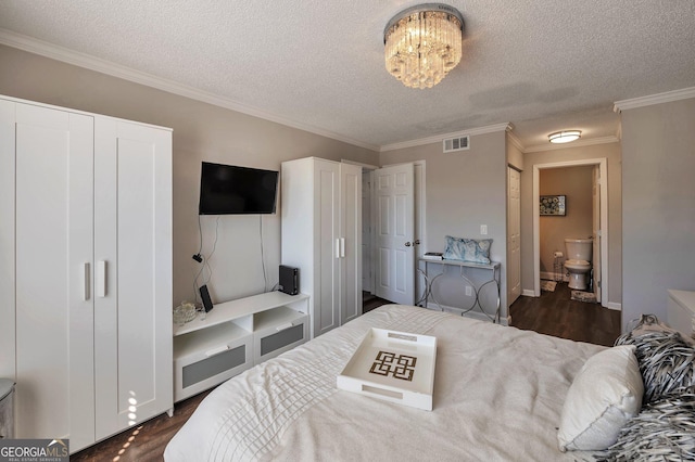 bedroom with a textured ceiling, visible vents, ornamental molding, dark wood-style floors, and an inviting chandelier