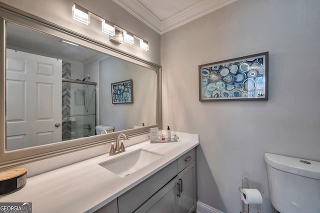 bathroom with vanity, ornamental molding, an enclosed shower, and toilet