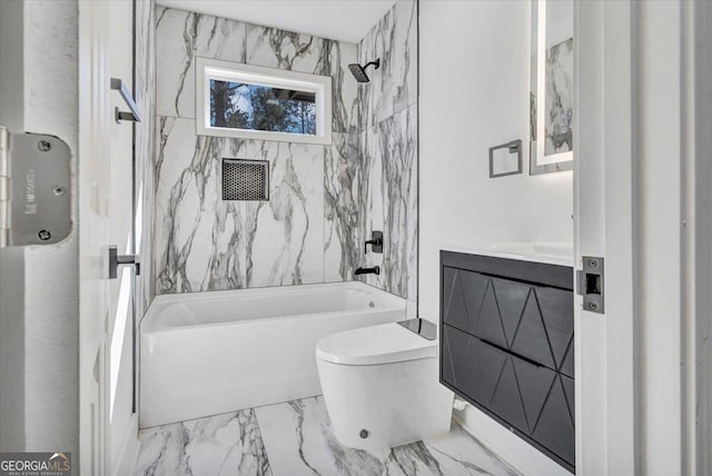 bathroom featuring washtub / shower combination, marble finish floor, vanity, and toilet