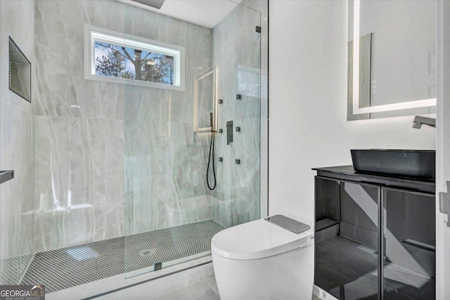 bathroom with a shower stall and toilet