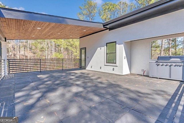 view of patio with a grill