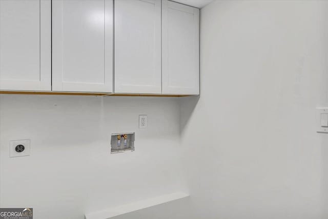 laundry area featuring washer hookup, cabinet space, and electric dryer hookup