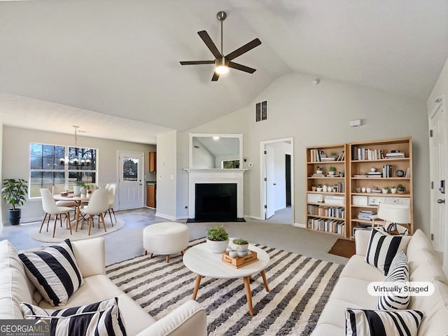 living area featuring visible vents, carpet floors, a fireplace, high vaulted ceiling, and ceiling fan with notable chandelier