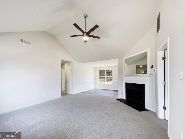 unfurnished living room with a fireplace with flush hearth, visible vents, ceiling fan, and light colored carpet