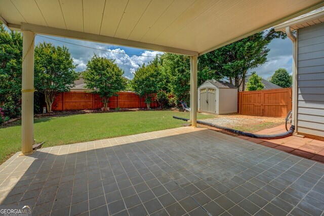 1186 Diamond Xing, Mcdonough, GA 30252 - view of patio / terrace with a shed and an outbuilding